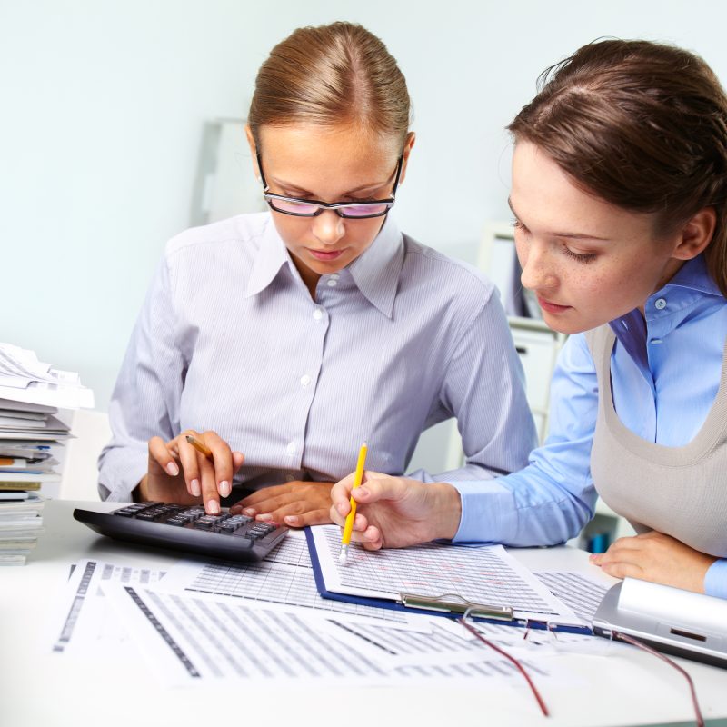 businesswomen reviewing results scaled